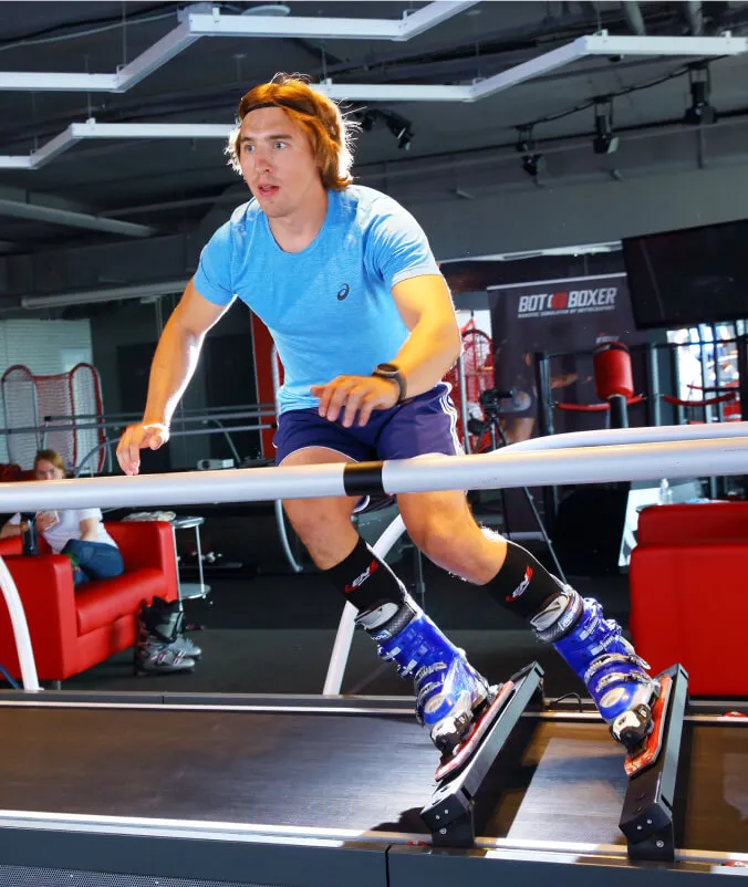 Skier performing a carve on simulator