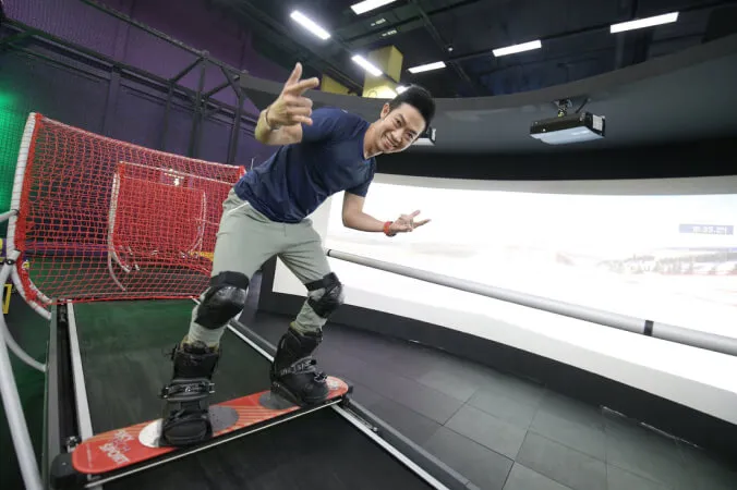 Coach and athlete on ski simulator