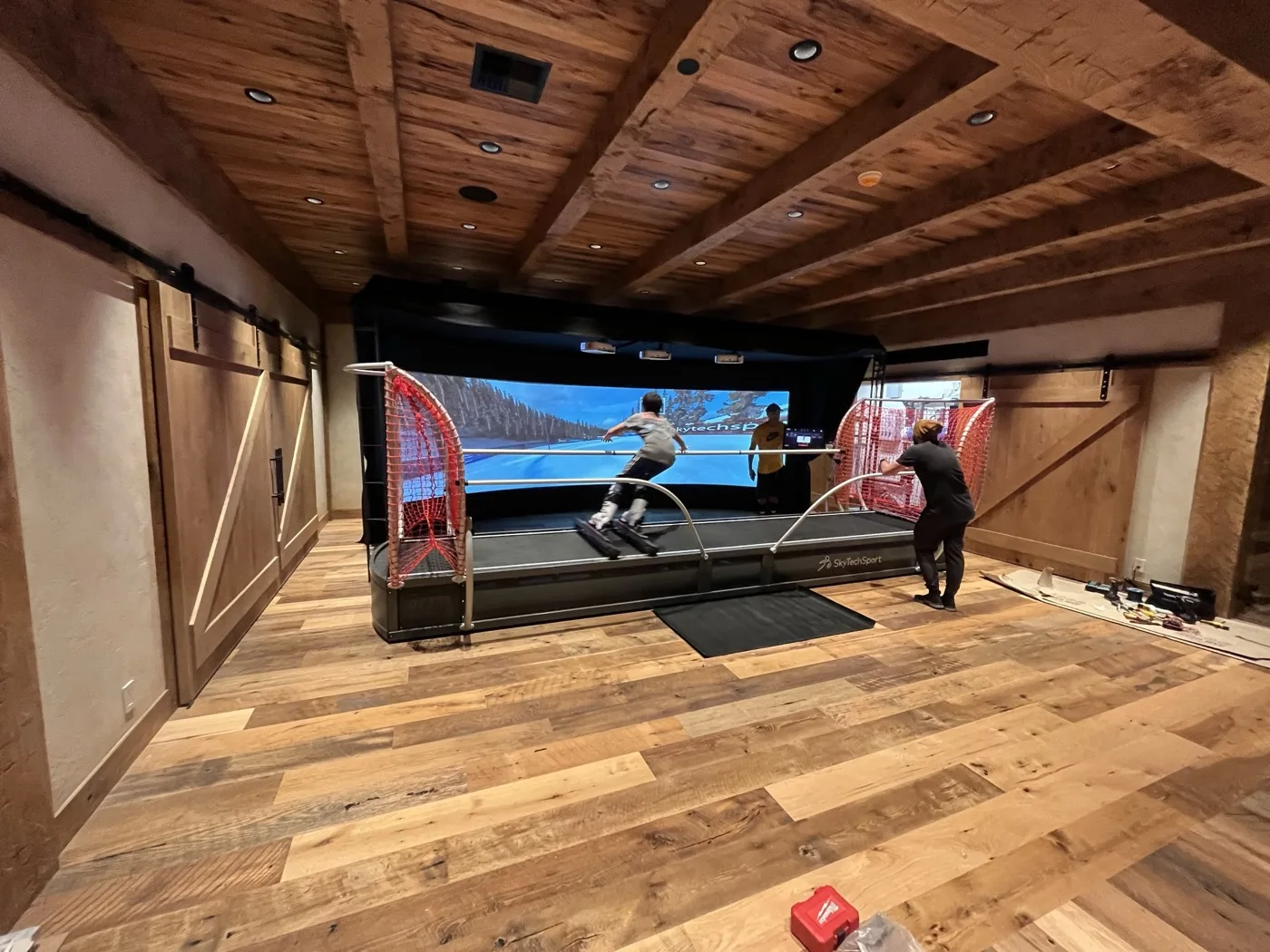 Skiing a SkyTechSport simulator in an alpine chalet home