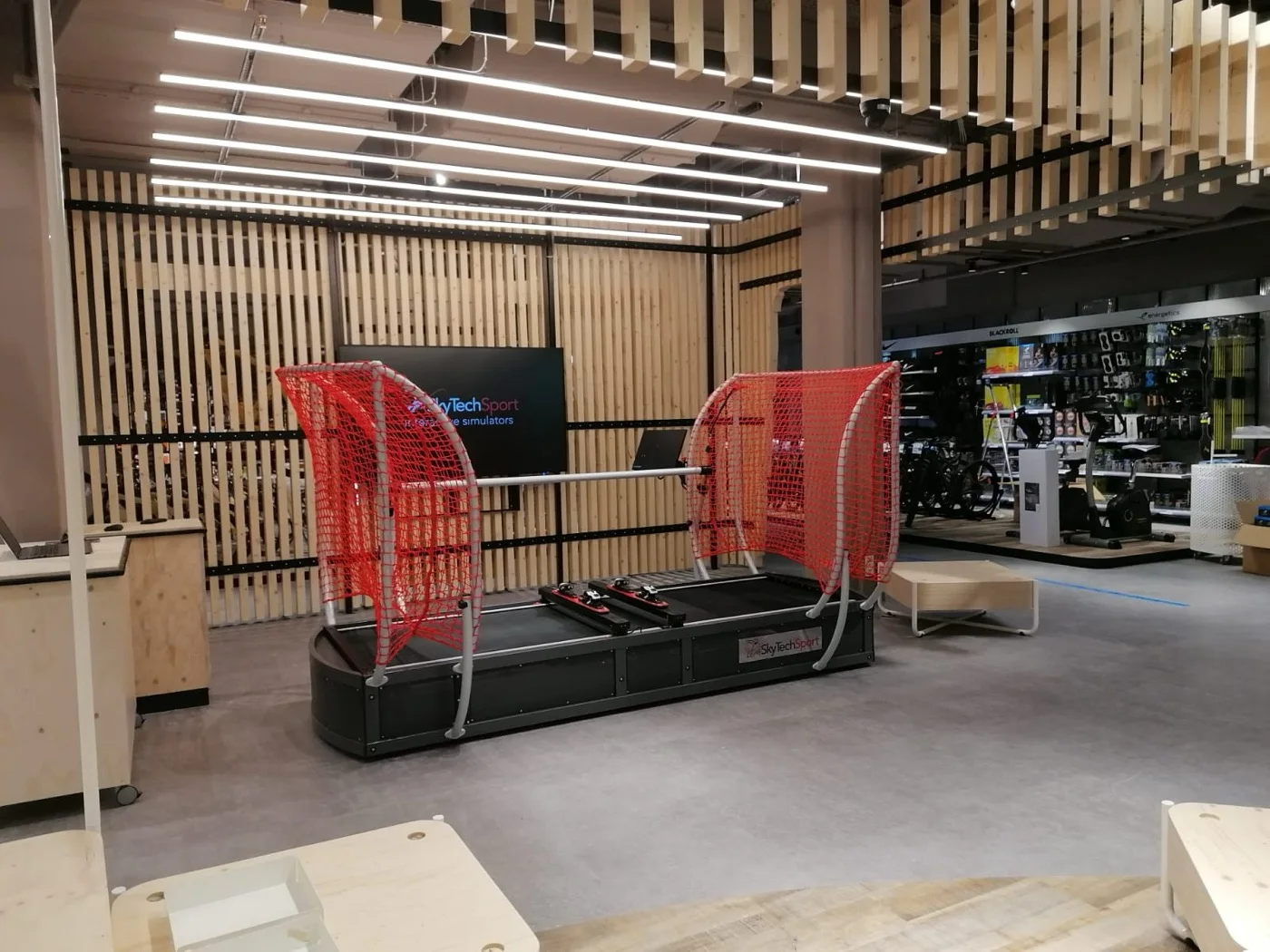 SkyTechSport ski simulator in a modern retail showroom